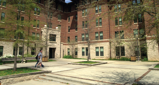 Multi-story residence hall with landscaped entrance