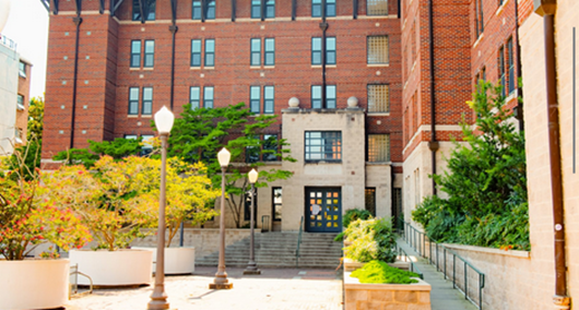 Multi-story residence hall with landscaped entrance