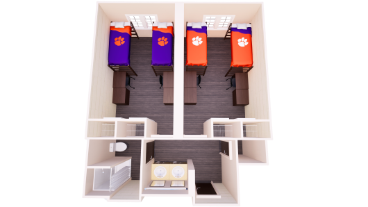 3D floor plan of a suite-style dorm with two double bedrooms, each with two beds and desks, connected by a shared bathroom area with two sinks, one toilet, and one shower.